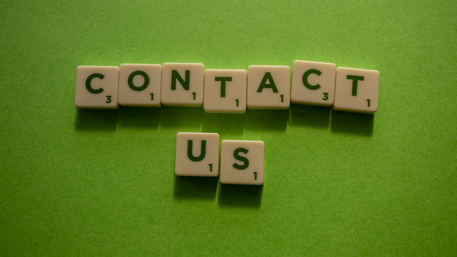 Contact us spelled out in letter tiles